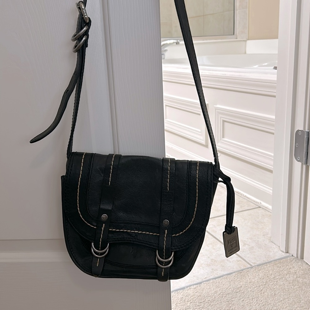 Frye black cross body purse with snap closure